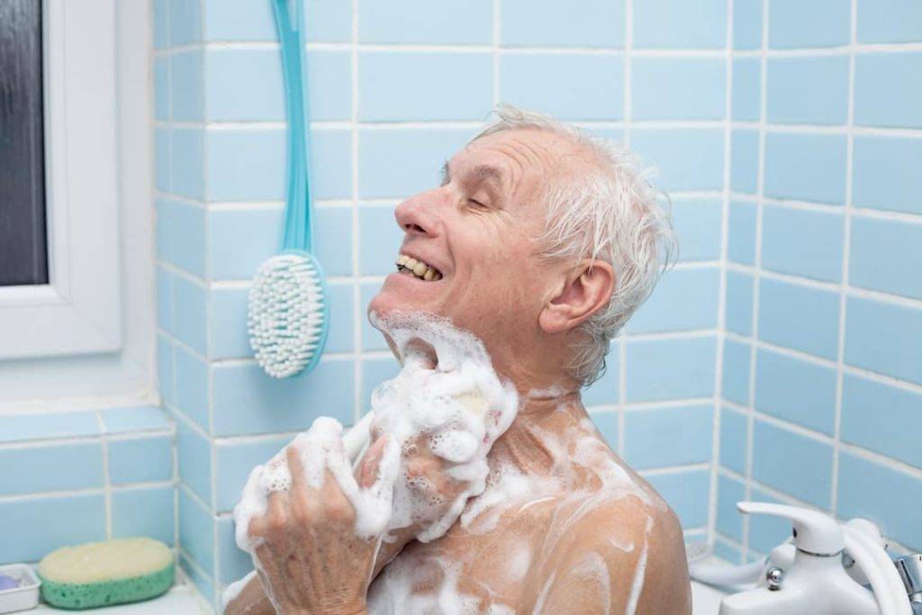elderly man having a shower